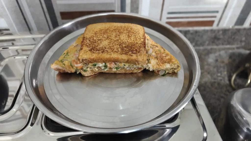 Simple homemade omelet breakfast before my Sunday cycling ride Three-egg omelet with vegetables and toasted bread prepared for breakfast before a Sunday cycling ride